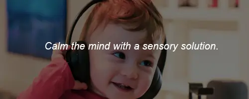 happy kid child smiling happy with sensory soundproof bluetooth headphones for autism and sensory overload